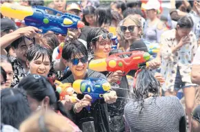  ?? ?? Revellers enjoy Songkran moments at CentralWor­ld last year.