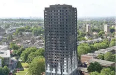  ?? — AFP ?? The remains of Grenfell Tower are pictured against the London skyline on Friday.