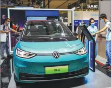  ?? WANG CHENGLONG / FOR CHINA DAILY ?? Volkswagen displays its ID.3, an electric vehicle, at the 2021 World New Energy Vehicle Congress, held in Haikou, Hainan province from Sept 15-17.