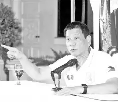  ?? — AFP photo ?? This handout photo shows Duterte gesturing as he speaks during a press conference at the presidenti­al guest house in Davao City.