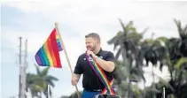  ?? SOUTH FLORIDA SUN SENTINEL FILE ?? Justin Flippen, then a Wilton Manors City Commission­er, in the 2017 Stonewall Pride parade on Wilton Drive. He was elected mayor Tuesday and will be part of an all-LGBT city commission.