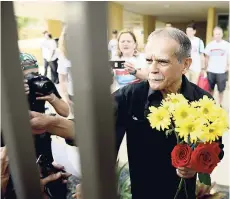  ?? AP ?? Puerto Rican nationalis­t Oscar Lopez Rivera greets well-wishers as he is released from home confinemen­t after 36 years in federal custody, in San Juan, Puerto Rico, yesterday.