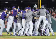  ?? Pablo Martinez Monsivais ?? The Associated Press The Chicago Cubs celebrate after beating the Washington Nationals 9-8 to win their National League Division Series on Friday morning.