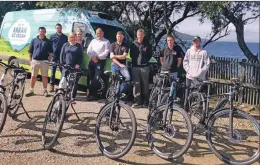  ??  ?? Arran Dairies staff at the start of their month long e-bike stint.