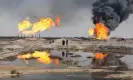  ?? ?? ‘In Iraq, the law states that gas flaring shouldn’t be closer than 10km (6 miles) from people’s homes.’ Excess gas is burned off near workers at the Rumaila oil field, south of Basra. Photograph: Atef Hassan/REUTERS