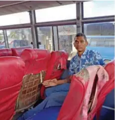  ?? Photo: Wati Talebula-Nuku ?? Shore Bus driver Umen Ram shows the damage done to the bus seat on June 30, 2022.