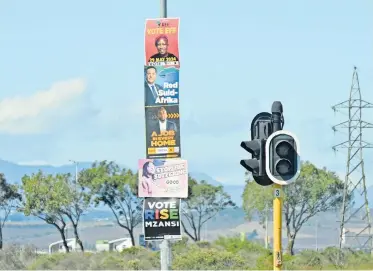  ?? AYANDA NDAMANE Independen­t Newspapers ?? POLITICAL parties’ election campaign posters adorn street poles in Hindle Road, Blue Downs, but the ANC’s is conspicuou­sly missing. |