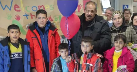  ?? ANDREW VAUGHAN/THE CANADIAN PRESS ?? The Ayash family upon arrival in Halifax on Feb. 29. The Syrian newcomers were sponsored by a community group in Lunenburg, N.S.