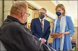  ??  ?? Gov. Mike Dewine and his wife,
Fran, visit with a man waiting to get his COVID vaccine recently at New Carlisle Senior Living.