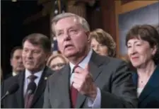  ?? J. SCOTT APPLEWHITE - THE ASSOCIATED PRESS ?? Sen. Lindsey Graham, R-S.C., flanked by, Sen. Mike Rounds, R-S.D., left, and Sen. Susan Collins, R-Maine, discuss the bipartisan immigratio­n deal they reached during a news conference at the Capitol in Washington, Thursday. The Trump administra­tion is...