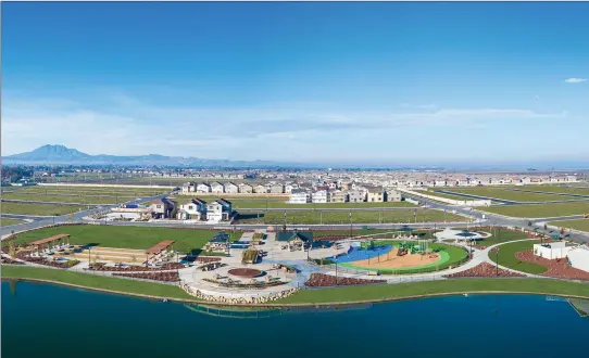  ??  ?? Delaney Park in Oakley features five neighborho­ods, community parks, playground­s and lake trails now open for touring.