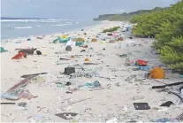  ?? JENNIFER LAVERS VIA AP ?? In this 2015 photo, plastic debris is strewn on the beach on Henderson Island. When researcher­s traveled to the tiny, uninhabite­d island in the middle of the Pacific Ocean, they were astonished to find an estimated 38 million pieces of trash washed up...