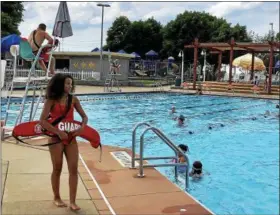  ?? TAWANA ROBERTS — THE NEWS-HERALD ?? Lifeguard Myla Hodge, who is 15 years old, maintains safety and enforces rules at Willoughby Municipal Swimming Pool.