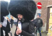  ?? (Courtesy) ?? PEOPLE SPORT costumes resembling hassidim during the Carnival festival in Aalst, Belgium, on Sunday.