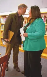  ?? JON AUSTRIA/JOURNAL ?? Albuquerqu­e Mayor Tim Keller speaks with incoming Albuquerqu­e Public Schools Superinten­dent Gabriella Blakey before a news conference at Polk Middle School in February.