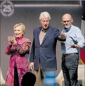  ?? Arkansas Democrat-Gazette/BENJAMIN KRAIN ?? Hillary and Bill Clinton, along with moderator and longtime associate James Carville (right), greet the crowd Saturday evening at the Statehouse Convention Center in downtown Little Rock.