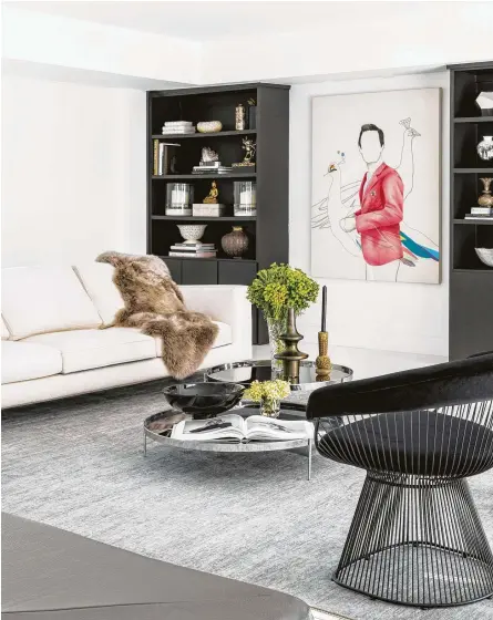  ??  ?? A pair of Platner chairs brings a midcentury-modern vibe to this intimate seating space in the main living area.