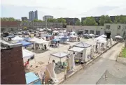  ?? PHOTOS BY BARBARA J. PERENIC/COLUMBUS DISPATCH ?? Scrawl 15 concluded its two-day festival on Aug. 29, at 400 Square between Rich and Town streets in Franklinto­n.