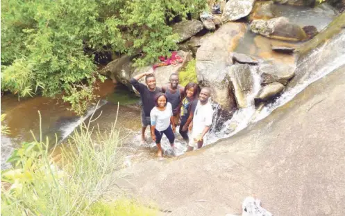  ??  ?? The A’ cube Hiking Group exploring Beyla Mountains, behind ECWA Staff School, Jos