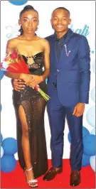  ?? ?? L-R Hope Manyatsi wore a black velvet top black dress and black lace bottom with a thigh high slit and Lindani Vilakati opted for a blue suit.