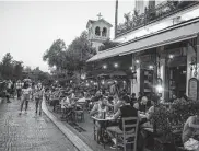  ?? Petros Giannakour­is / Associated Press ?? Customers dine Friday at a restaurant in Athens. Greece now requires proof of a vaccine for access to indoor restaurant­s, cafes, bars and movie theaters.