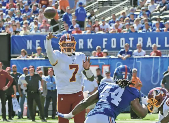  ?? BILL KOSTROUN/AP ?? Redskins quarterbac­k Dwayne Haskins throws against the Giants on Sunday in East Rutherford, N.J. Haskins completed 9 of 17 passes for 107 yards and three intercepti­ons in the game.