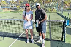  ?? ?? i Love all: Shane and her tennis coach Dillo on the courts at Curtain Bluff