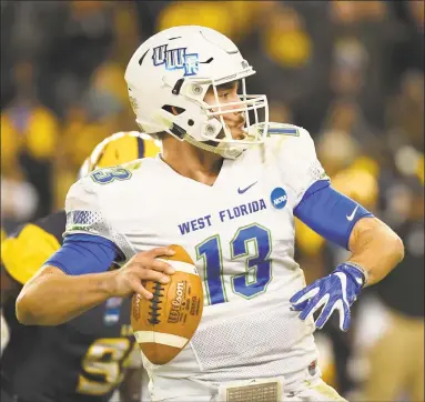  ?? Reed Hoffmann / AP ?? West Florida quarterbac­k Mike Beaudry (13) looks to throw during the second half of the NCAA Division II college football championsh­ip game in Kansas City, Kan., on Dec. 16, 2017.