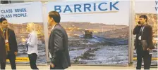  ?? CHRIS HELGREN/REUTERS FILES ?? Barrick says deals are more attractive amid gold’s rise. Above, participan­ts at a mining conference in Toronto.