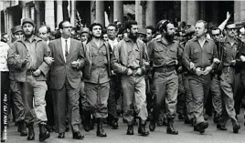  ??  ?? Fidel Castro (far left) and Che Guevara (third from left) march in demonstrat­ion to a memorial service for the victims of the La Coubre explosion, 5 March 1960