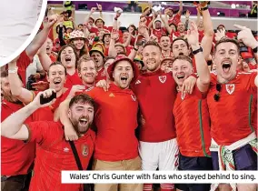  ?? ?? Wales’ Chris Gunter with fans who stayed behind to sing.