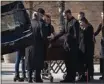  ?? SARAHBETH MANEY — FOR THE ASSOCIATED PRESS ?? Relatives and loved ones gather around the casket of Michigan State University shooting victim Alexandria Verner, 20, after a funeral Mass at the Guardian Angels Catholic Church in Clawson, Mich., on Saturday.