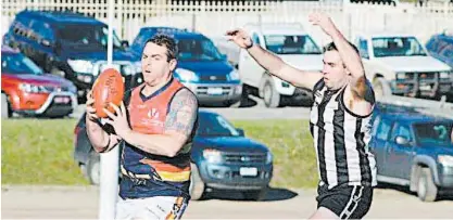  ??  ?? Longwarry coach Daniel Fry kicked four goals in the Crows’ win over Poowong; Photograph­s: Amity Stephens.