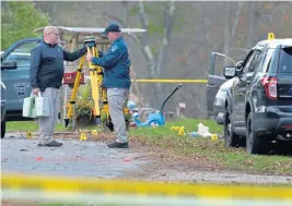  ?? CHRIS CHRISTO / BOSTON HERALD ?? SURVEYING THE MATTER: Officers sent to the scene of yesterday’s violent incident in New Salem, in which a trooper was allegedly slashed on the forehead, check out the area.