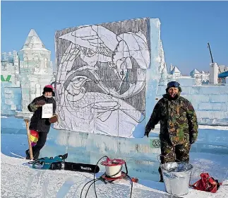  ?? PHOTO: SUPPLIED ?? Tatiana Zimina and team-mate Dasha Tapa, right, mark their sculpture out on their ice block before starting to carve.