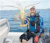  ?? PHOTOS BY STEVEWATER­S/STAFF ?? Making sure that you and your dive gear are in good shape well before the lobster miniseason begins are keys to enjoying the annual event, which is July 26-27.