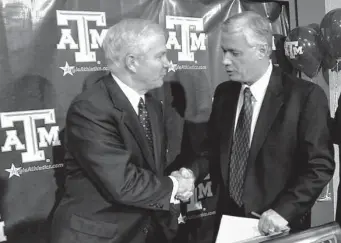  ?? Associated Press file photo ?? Not every move in A&M’s 2002 shakeup of the athletic department under school president Robert Gates panned out, especially the hiring of Dennis Franchione, right, as football coach.