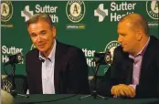  ?? JANE TYSKA — BAY AREA NEWS GROUP, FILE ?? A’s executive Billy Beane, left, and general manager David Forst answer questions during a 2018 press conference at the Coliseum in Oakland.