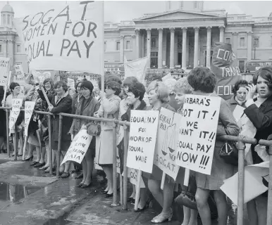  ??  ?? Change in the air Demonstrat­ors demand equal pay for women at a protest in Trafalgar Square, May 1969. Their campaign – spearheade­d by a strike at Ford’s Dagenham plant – led to a change in legislatio­n in 1970