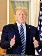  ??  ?? Donald Trump told Fox News he hoped to hold a rally in Florida on Saturday, and possibly another in Pennsylvan­ia despite his coronaviru­s infection. Photograph: Nicholas Kamm/AFP