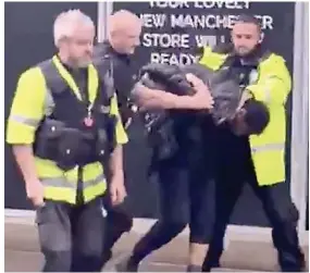  ??  ?? Police officers lead the 41-year-old man away in Manchester yesterday