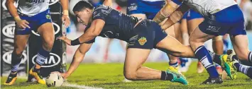 ??  ?? STEPPING UP: Cowboys’ Jason Taumalolo scores a try against the Bulldogs on Thursday.