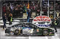  ?? [AP/LARRY PAPKE] ?? Kevin Harvick celebrates after winning Texas and punching his
Championsh­ip Round ticket to Homestead.