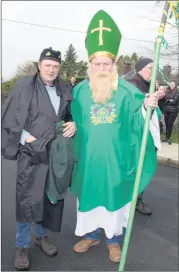  ?? (Photo: Ita West) ?? WHERE ARE THE SNAKES? Piper Pa Cronin with St. Patrick (Tommy O’Sullivan) in Kilfinane last Friday.