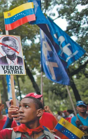  ?? FOTOS: AP, AFP Y DPA ?? positora Mesa de la Unidad Democrátic­a durante un acto público en Caracas.