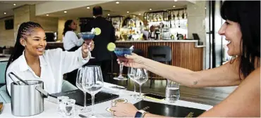  ?? Pictures: Denvor de Wee ?? Ayanda Thabethe shares a toast with Aspasia Karras at the @Sandton Hotel.