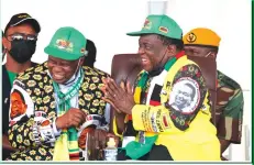  ?? ?? President Mnangagwa shares a lighter moment with National Secretary ZANU PF for Finance, Cde Patrick Chinamasa, at the Mutasa South victory celebratio­ns.