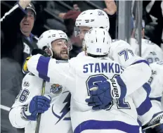  ?? THE ASSOCIATED PRESS FILES ?? Tampa Bay’s Nikita Kucherov, left, celebrates a goal with Victor Hedman, right, and Steven Stamkos during a game last month. The trio, along with goalie Nikita Kucherov, will represent the Lightning in the NHL All- Star Game.