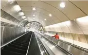  ?? TIMOTHY A. CLARY/GETTY-AFP ?? A person rides an escalator Jan. 23 in the new Grand Central Madison terminal in New York.