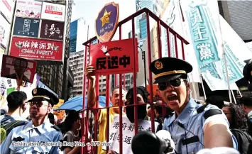  ??  ?? Activists attend a protest in Hong Kong. — AFP photo